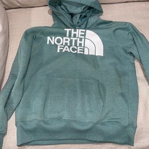 Teal Women’s North Face hoodie. Worn twice, small pink stain as shown.